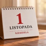 Calendar on a wooden table showing November 1, a Sunday (1 LISTOPADA NIEDZIELA) with a red numeral 1 and black text.