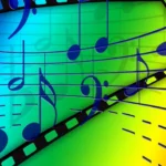 Colorful rainbow background with musical notes and a film strip, suggesting music and cinema.